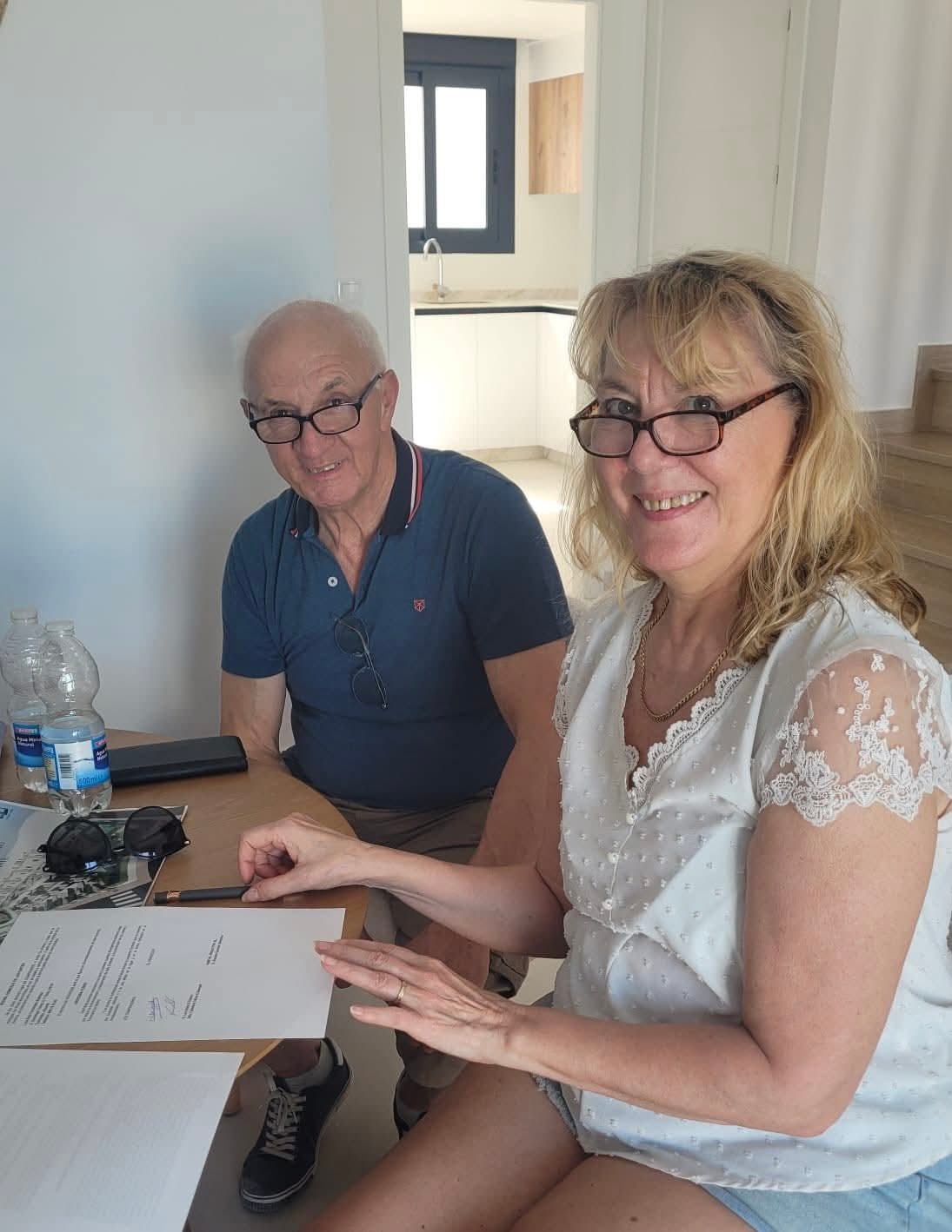 Fabienne and Luc signing for their house in Cox