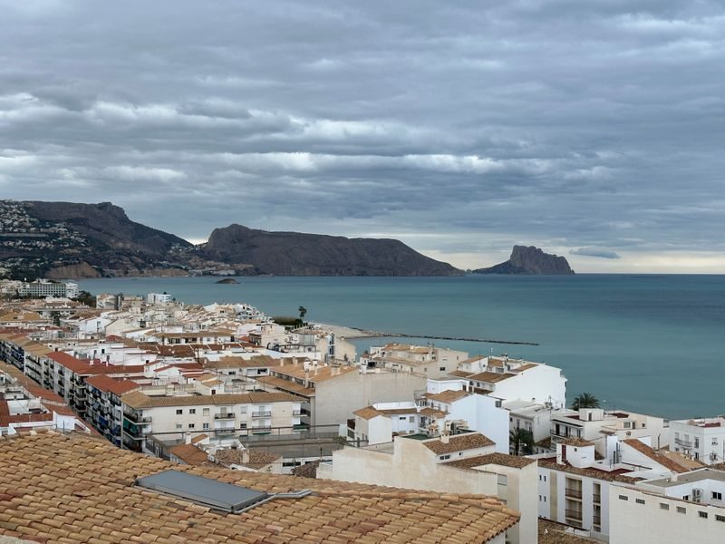 The bay of Altea, its white rooftops and the Ifach rock on the horizon