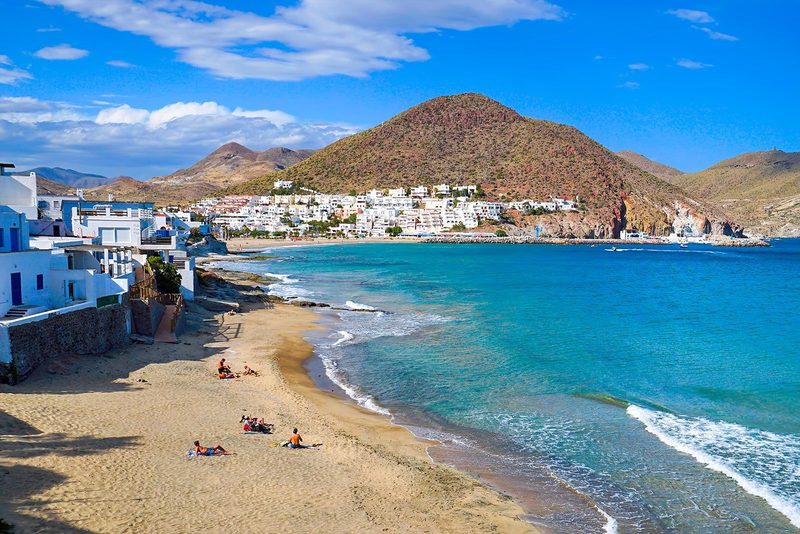 A white village and its turquoise beach in the Cabo de Gata nature park